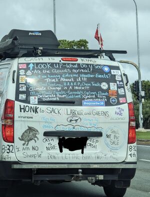 A van with lots of writing on it.